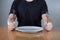 Man sitting at a table waiting for food