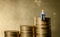 Man sitting on top of pile stack of golden coins