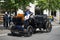 Man sitting in vintage car parked in city street road