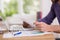 Man sitting working at his desk reading a document