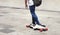 Man on skateboard longboard closeup in the city