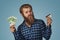 Man skeptical choosing plastic credit card or money cash euro banknotes bills