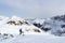 Man on ski looking at mountain snow panorama before downhill in Stubai Alps