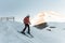 Man skier riding by snowy piste