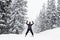 Man skiing on slopes in the french alps, snowing