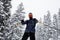 Man skiing on slopes in the french alps, snowing