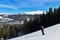 Man skiing on snowy hill at Breckenridge ski resort. Extreme winter sports.