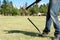 Man with sledgehammer hitting large metal spike