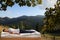 Man sleeping on bed and beautiful view of mountain landscape on background. Sleep well - stay healthy