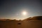 Man sleeping in the desert looking at stars, empty quarter, Oman