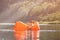 Man sleeping inside inflatable lounger in water