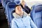 Man sleeping in travel bus with cervical pillow