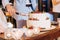 man slices festive fruit cake knife cream