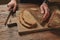 Man slicing tasty fresh bread.