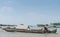 Man on sloop sailing Mekong River near Cai Be, Vietnam