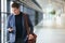 Man on smart phone - young business man in airport