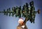 Man in smart suit and Santa hat on blue background