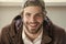 Man with smile on bearded face wear baseball cap