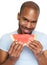 Man smiling and eating delicious watermelon