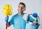 Man smiling happy doing house cleaning holding mop and bucket washing