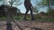 Man in sneakers learns walk and balance on balancing rope from rubber in a park in Germany. Sport, leisure, recreation