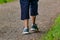 Man with sneakers running on a path, helathy activity to make exercice