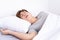 Man snoring loudly because of tired from work, sleep apnea lying in the bed. Healthcare medical or daily life concept