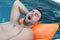 Man snoring in swimming pool