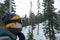 Man on with snow goggles on a ski lift, facing right,  kirkwood resort, California, USA January 4, 2020