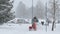 Man with Snowblower in Blizzard