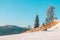 man with snowboard sitting on slope mountains on background