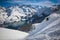 Man Snowboard turn with lake and mountains