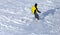 A man snowboarding a mountain in the snow in winter