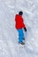 A man snowboarding a mountain in the snow in winter