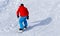 A man snowboarding a mountain in the snow in winter