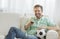 Man With Soccer Ball Watching TV