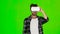 Man from something deviates in VR mask. Green screen