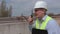 Man speaking on walky talky at construction site