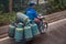 Man speeds on motorcycle with 7 gas canisters, Chongqing, China