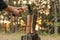 Man splitting firewood with axe in forest, closeup