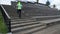 A man in sportswear runs up the wooden steps