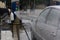 Man Spraying Active Foam During Car Washing