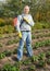 Man spraying strawberry plant