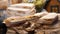 Man spreading baked onions on a large slice of bread, traditional Polish food festival market stall closeup detail, traditional