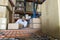 Man Stacking Boxes In Warehouse