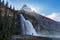 A man stand before Emperor Falls and Mount Robson, Emperor Ridge along Berg Lake Hiking Trail in Canadian Rocky Mountains