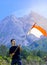 A man stand with Indonesia flag stands with Merapi Mt background. indonesia independence day celebration concept