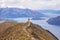 Man stand on Roy`s Peak, Wanaka, New Zealand