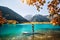 Man on stand up paddle board at mountain lake