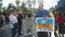 Man standing with banner Ukraine needs the support of the world at peaceful rally against russia invasion of Ukraine. Protests to